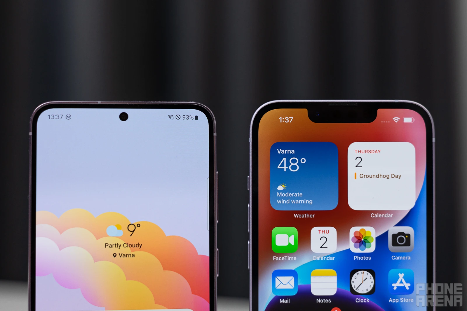 Galaxy S23 vs iPhone 14, Infinity O vs Notch (Image Credit - PhoneArena - Samsung Galaxy S23 vs Apple iPhone 14: more for your $800!
