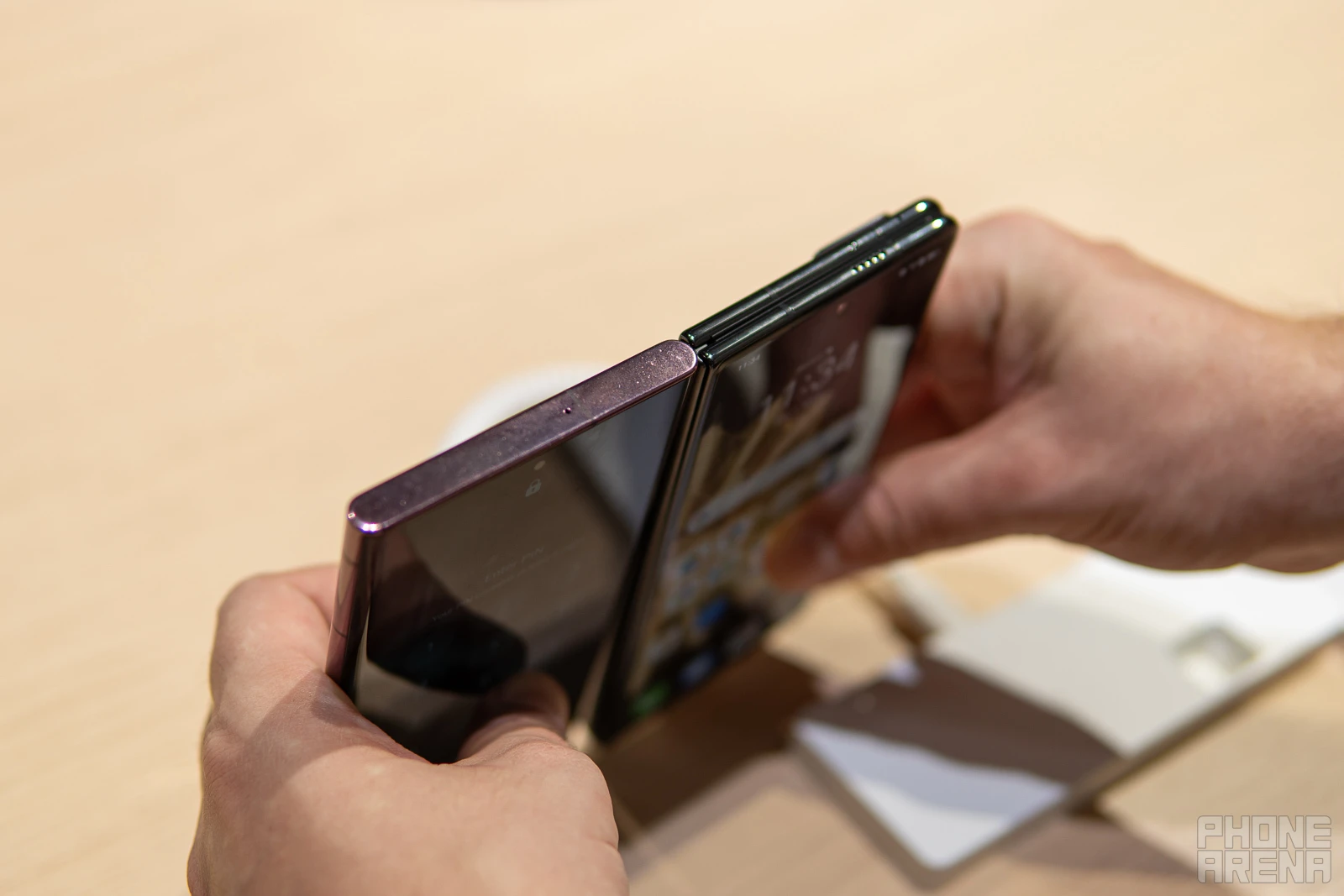 Honor Magic V2 thickness, next to Galaxy S22 Ultra (Image credit - PhoneArena) - Honor Magic V2 hands-on: thin on the outside, packed to the brim on the inside