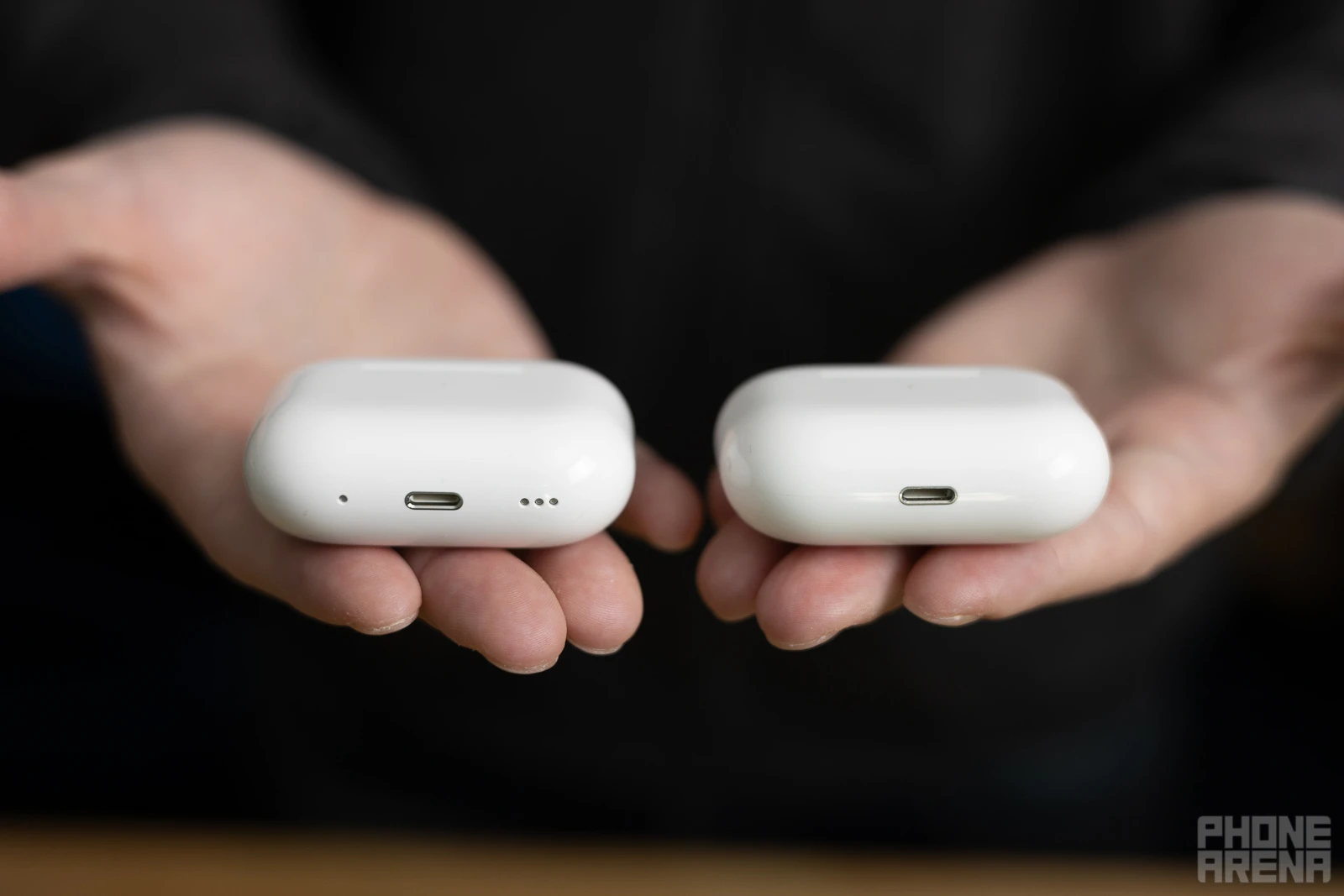 AirPods Pro 2 (left, note the new speaker grill next to the charging port) vs AirPods Pro (right) - AirPods Pro 2 vs AirPods Pro comparison: What's different?