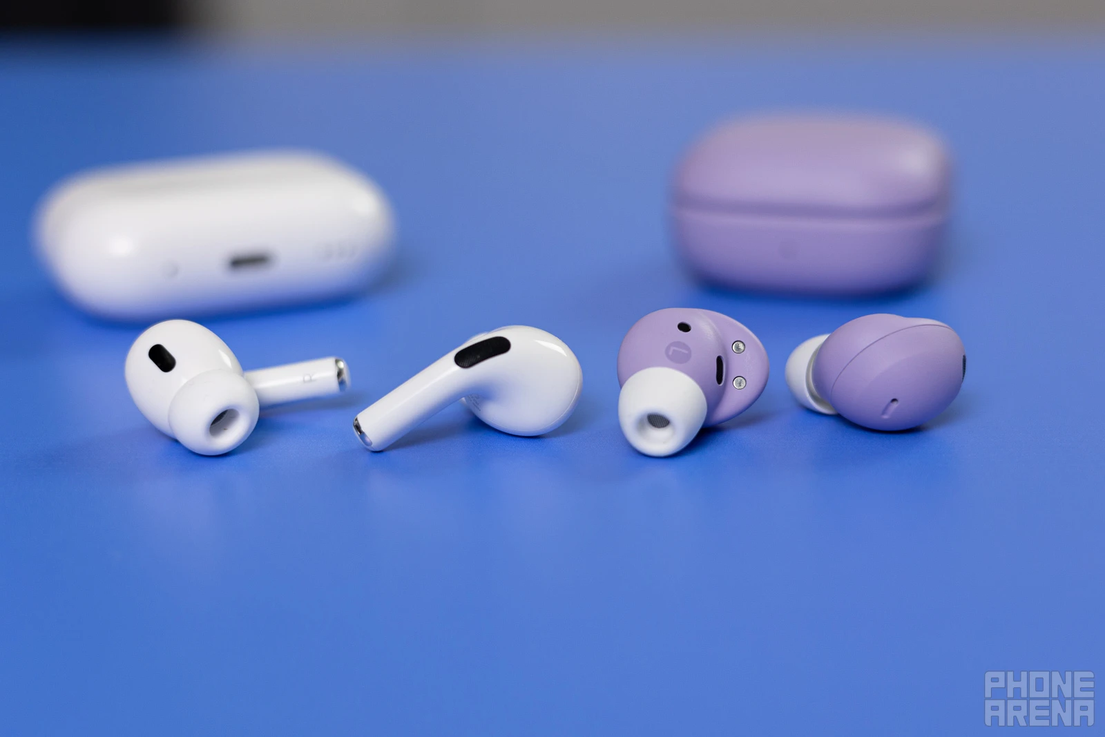 (Image credit - PhoneArena) Apple AirPods Pro 2 (left) and Samsung Galaxy Buds 2 Pro (right) - AirPods Pro 2 vs Galaxy Buds 2 Pro: Team Apple or team Samsung – everyone wins!
