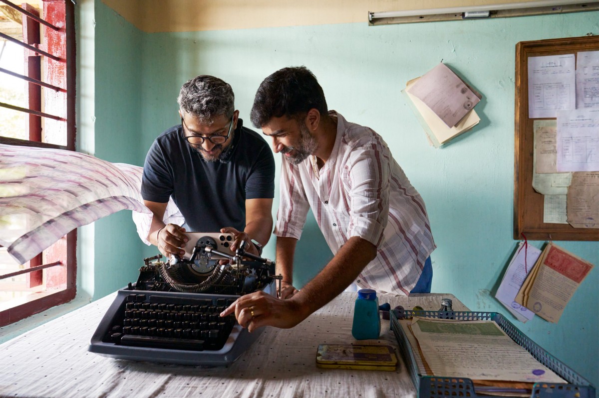 Rohin Raveendran Nair setting up a shot from inside a typewriter
